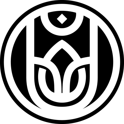 Black circular logo for Urban Atman, featuring a stylized emblem with geometric shapes resembling a human figure, lotus petals, and a diamond shape.