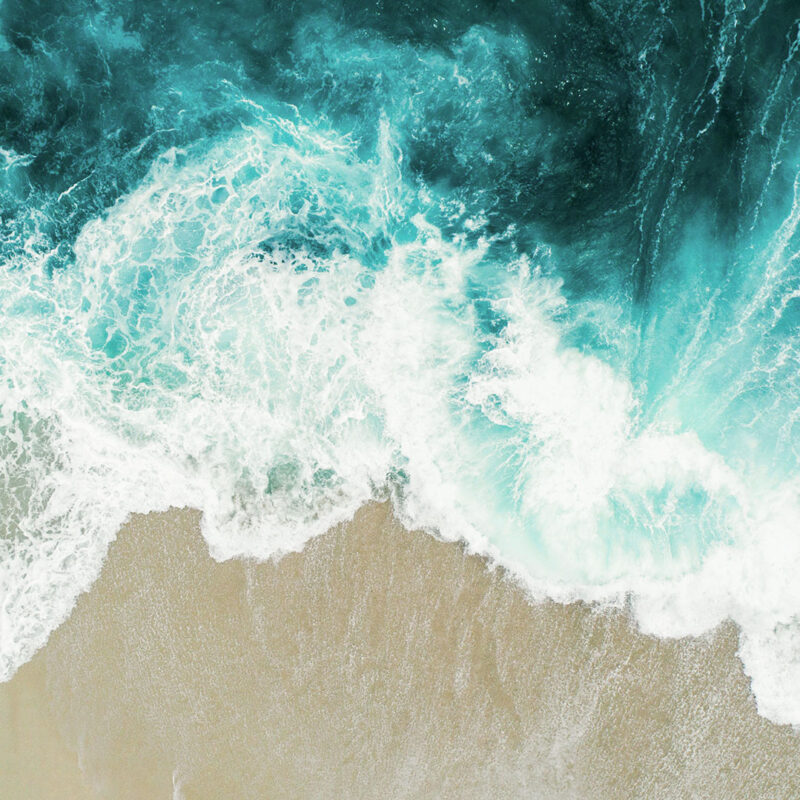 Aerial view of ocean waves on a beach